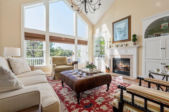 interior space featuring a chandelier and high vaulted ceiling