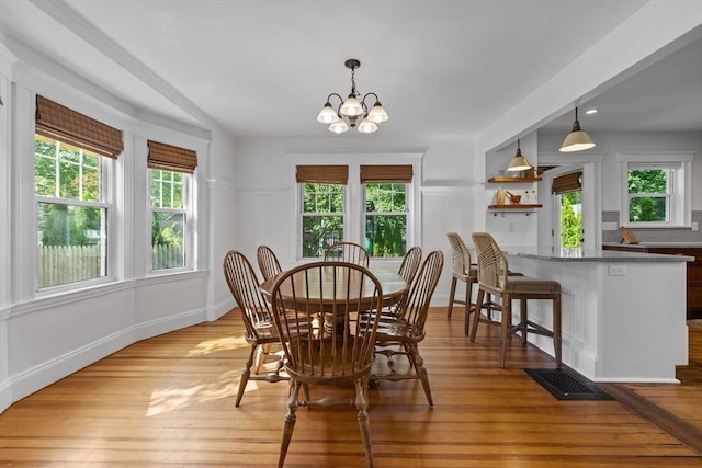 614 Summer St, Arlington, MA 02474 - dining area featuring a chandelier and light wood-type flooring