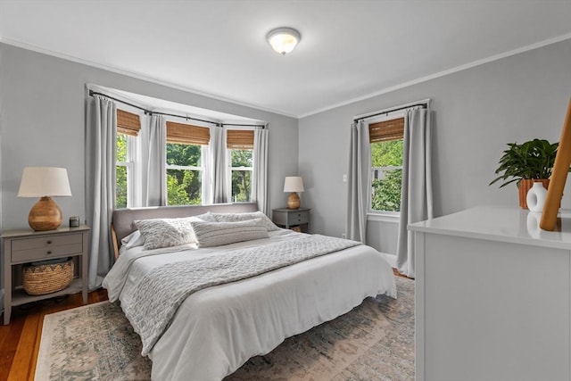 614 Summer St, Arlington, MA 02474 - bedroom featuring multiple windows, ornamental molding, and wood finished floors