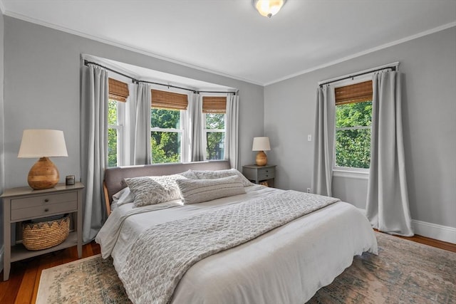 614 Summer St, Arlington, MA 02474 - bedroom with ornamental molding and wood finished floors