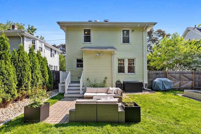 614 Summer St, Arlington, MA 02474 - rear view of property featuring outdoor lounge area, a patio, and a fenced backyard