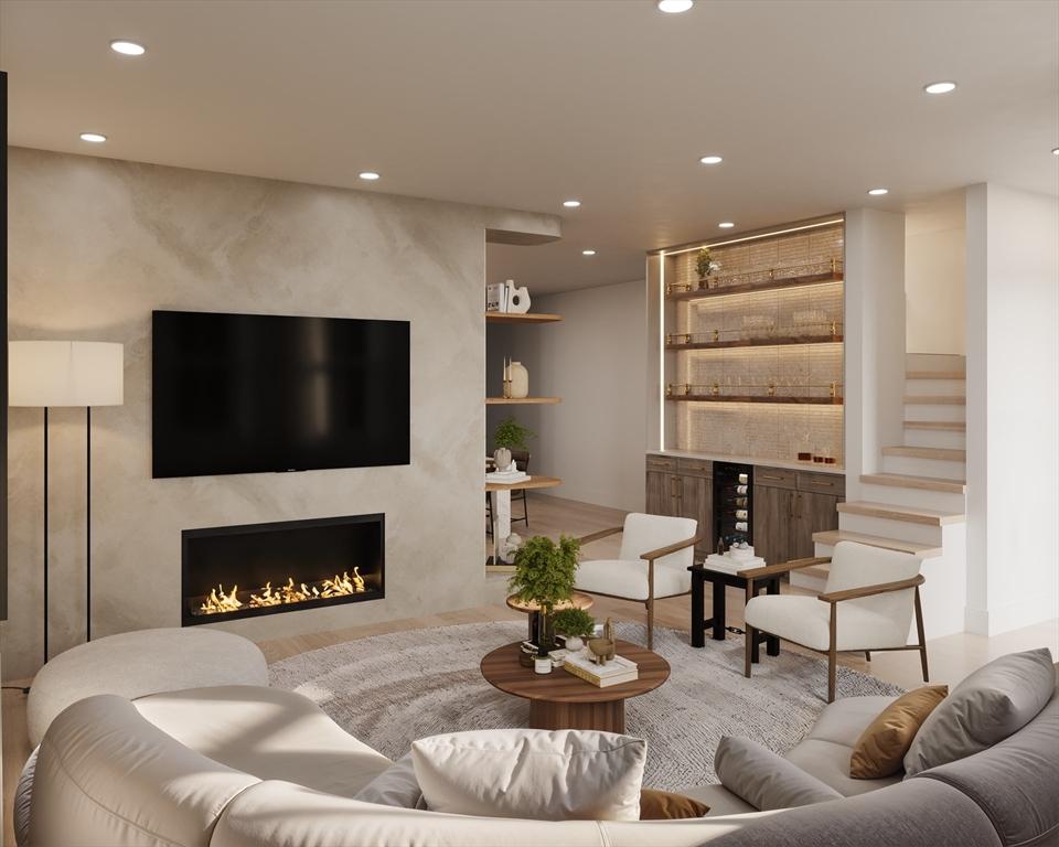 16 Trull St Unit 202, Somerville, MA 02145 - living room with a fireplace, recessed lighting, wood finished floors, and a dry bar