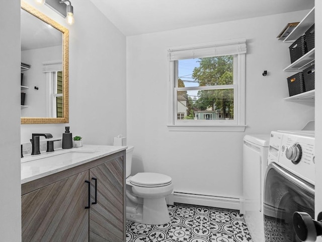 168 Maple St, Boston, MA 02132 - bathroom featuring a baseboard heating unit, vanity, tile patterned floors, and independent washer and dryer