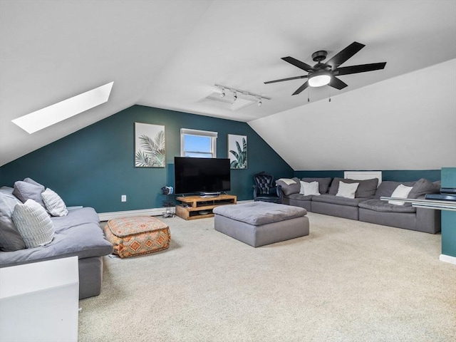 168 Maple St, Boston, MA 02132 - living area featuring carpet, lofted ceiling, a baseboard radiator, a skylight, and a ceiling fan
