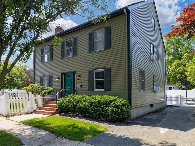 168 Maple St, Boston, MA 02132 - colonial house with a chimney and driveway
