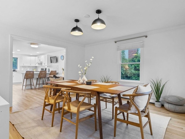 168 Maple St, Boston, MA 02132 - dining area featuring light wood-type flooring, crown molding, and recessed lighting