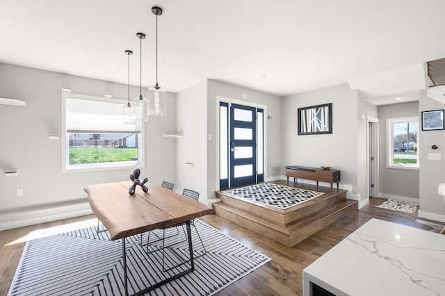 entryway with baseboards and dark wood-style flooring