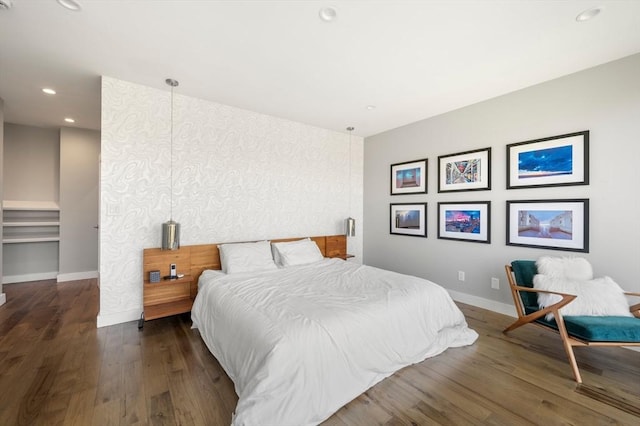 bedroom featuring recessed lighting, baseboards, and wood finished floors