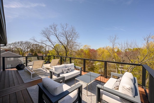wooden terrace featuring an outdoor hangout area