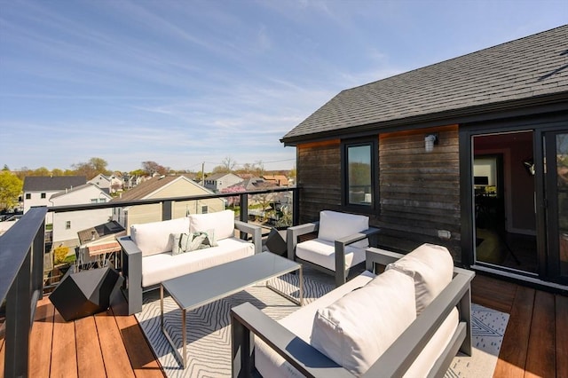 wooden terrace featuring an outdoor hangout area