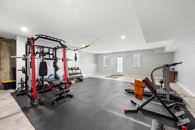 exercise area with recessed lighting and baseboards