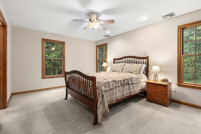 bedroom with baseboards, light carpet, a ceiling fan, and recessed lighting