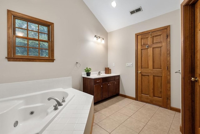 full bathroom with visible vents, tile patterned flooring, a jetted tub, vanity, and vaulted ceiling