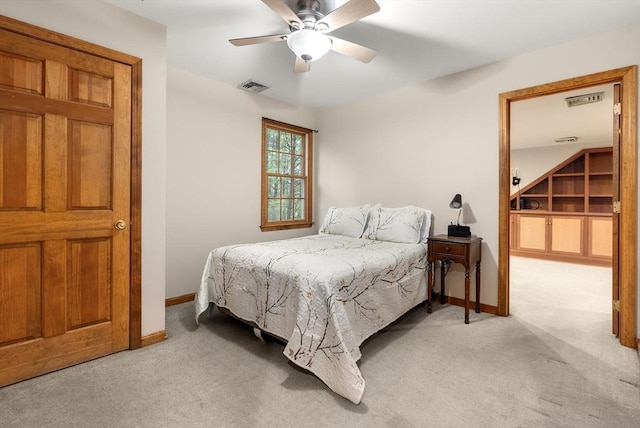 bedroom with light carpet, baseboards, and ceiling fan