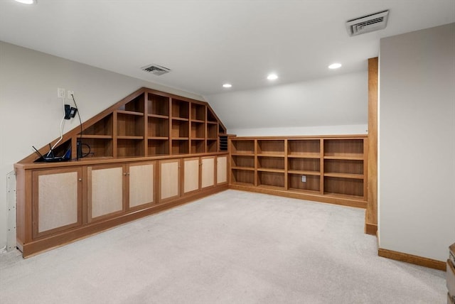 below grade area featuring light carpet, recessed lighting, and baseboards