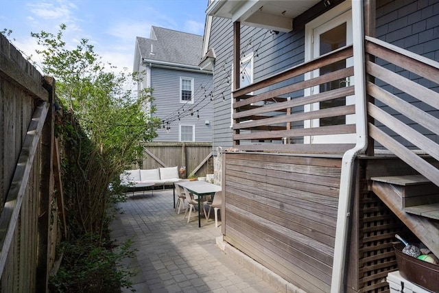 68 Cliftondale St, Boston, MA 02131 - wooden terrace with a patio area, an outdoor hangout area, and a fenced backyard