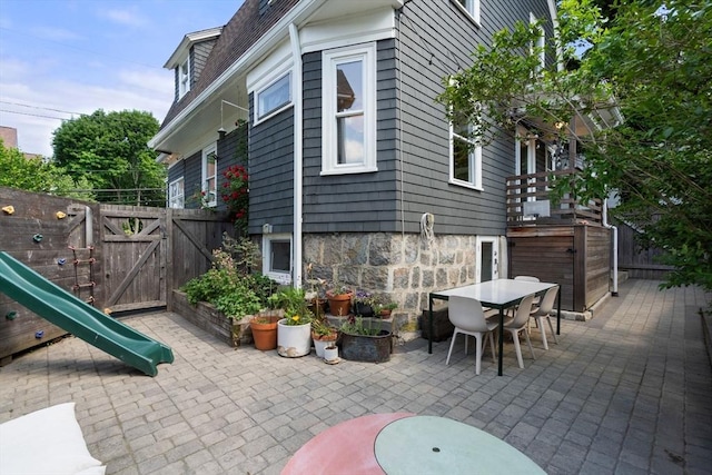 68 Cliftondale St, Boston, MA 02131 - view of patio featuring a gate and outdoor dining area
