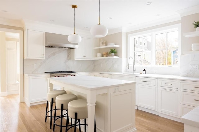15 Woodcliff Rd, Newton, MA 02461 - kitchen with open shelves, a sink, wall chimney exhaust hood, light wood-type flooring, and recessed lighting