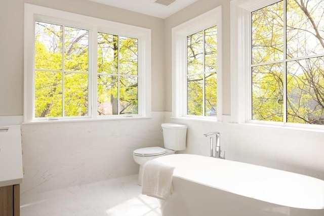 15 Woodcliff Rd, Newton, MA 02461 - bathroom with a freestanding tub and toilet