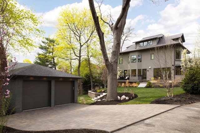 15 Woodcliff Rd, Newton, MA 02461 - view of home's exterior featuring a lawn, driveway, and a wooden deck