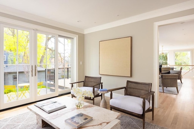 15 Woodcliff Rd, Newton, MA 02461 - sitting room with light wood-style flooring and crown molding