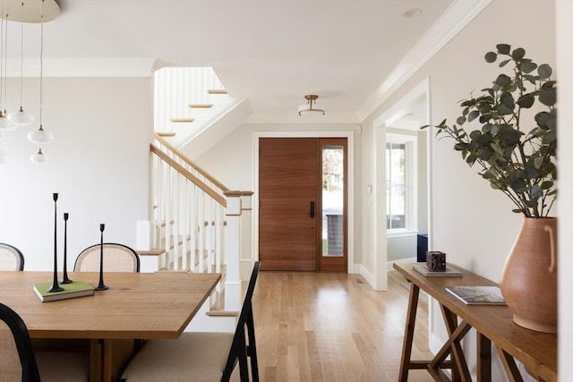 15 Woodcliff Rd, Newton, MA 02461 - foyer entrance with light wood-style flooring, stairs, ornamental molding, and baseboards
