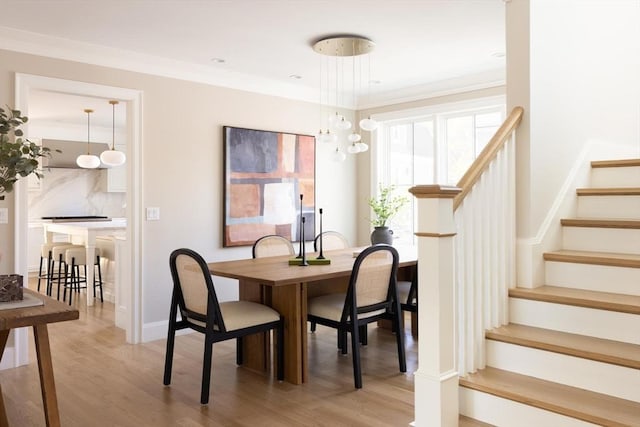 15 Woodcliff Rd, Newton, MA 02461 - dining space with stairs, light wood-type flooring, baseboards, and ornamental molding