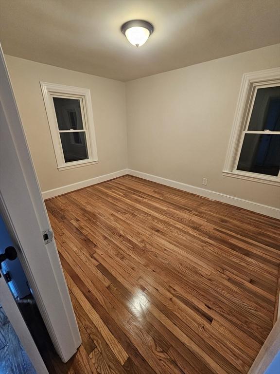 empty room featuring hardwood / wood-style floors