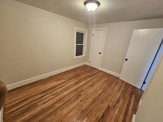 empty room featuring hardwood / wood-style flooring