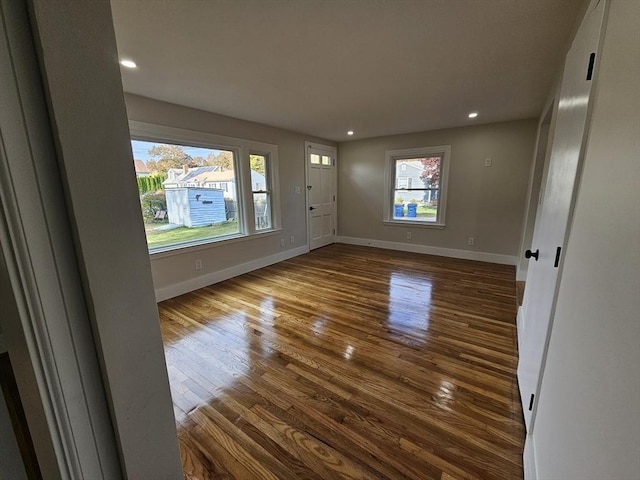 unfurnished room featuring hardwood / wood-style flooring