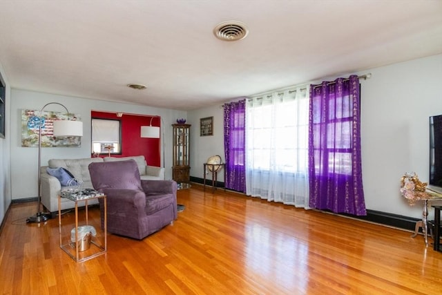 living room featuring wood finished floors and baseboards