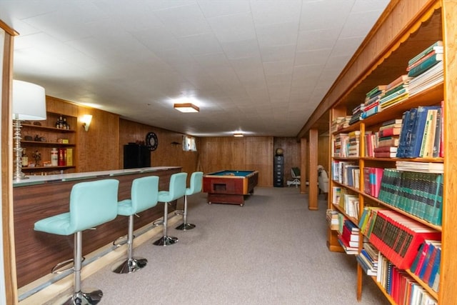 game room featuring carpet, wood walls, a dry bar, and billiards table