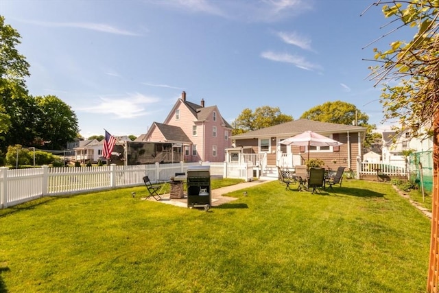 view of yard with a patio and a residential view