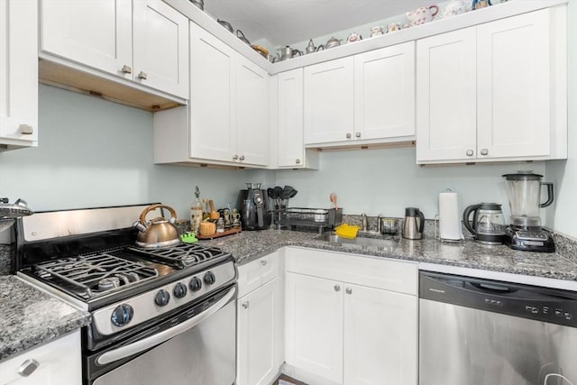 18 Auburn St, Framingham, MA 01701 - kitchen with light stone countertops, a sink, white cabinetry, and appliances with stainless steel finishes