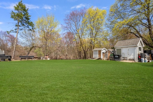 18 Auburn St, Framingham, MA 01701 - view of yard featuring an outdoor structure and a storage unit