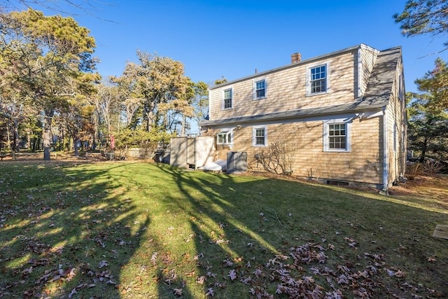 back of house featuring a yard