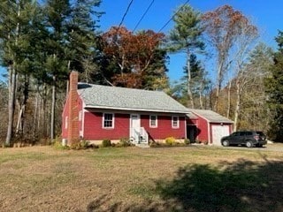 view of front of house featuring a garage and a front yard