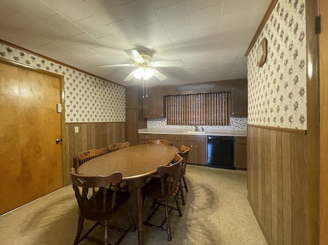 dining area with ceiling fan and sink