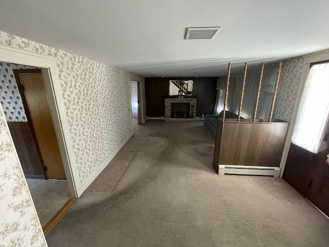 hall featuring carpet floors and a baseboard radiator