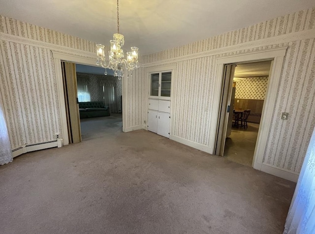 unfurnished dining area with carpet flooring, a baseboard radiator, and a notable chandelier