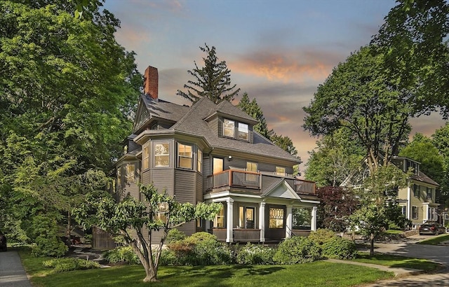 6 Francis Circuit Unit 6, Winchester, MA 01890 - victorian-style house with a balcony, a chimney, a lawn, and covered porch