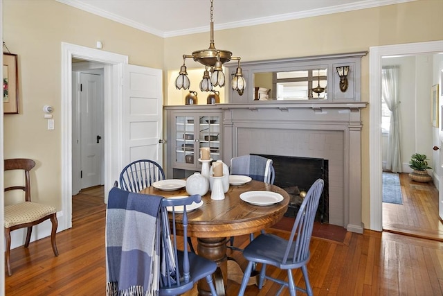 6 Francis Circuit Unit 6, Winchester, MA 01890 - dining area featuring wood-type flooring, crown molding, baseboards, and a fireplace
