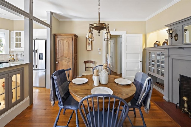 6 Francis Circuit Unit 6, Winchester, MA 01890 - dining space featuring hardwood / wood-style floors, crown molding, and a fireplace with flush hearth