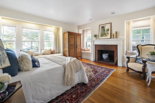6 Francis Circuit Unit 6, Winchester, MA 01890 - bedroom with multiple windows, wood finished floors, a fireplace, and recessed lighting