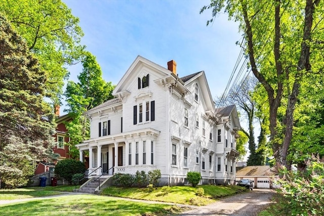 126 W Wyoming Ave, Melrose, MA 02176 - italianate house featuring a chimney and a front lawn