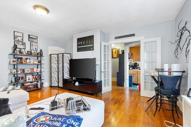 126 W Wyoming Ave, Melrose, MA 02176 - living area with french doors and hardwood / wood-style flooring