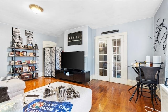 126 W Wyoming Ave, Melrose, MA 02176 - living area with french doors and hardwood / wood-style flooring