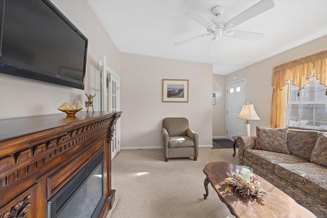 living room with light colored carpet and ceiling fan