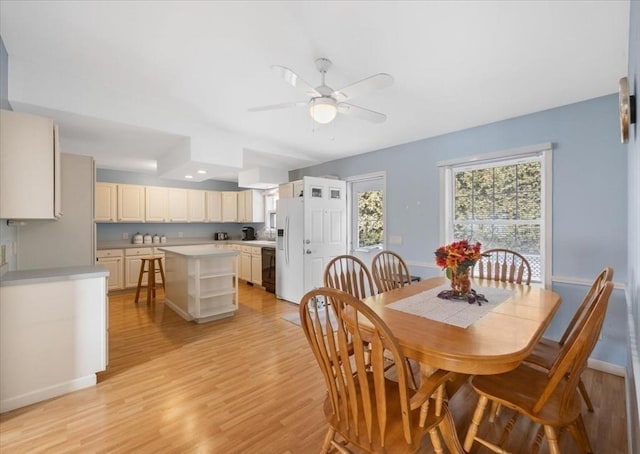 dining space featuring ceiling fan and light hardwood / wood-style flooring