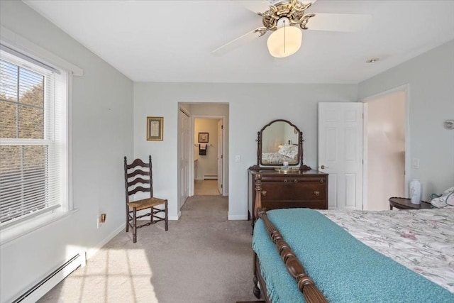 bedroom featuring a baseboard radiator, light carpet, and ceiling fan